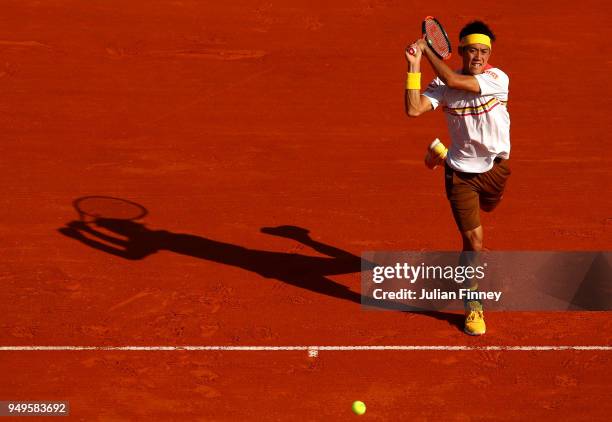 Kei Nishikori of Japan plays a forehand during his men's Semi-Final match against Alexander Zverev Jr. Of Germany during day seven of ATP Masters...