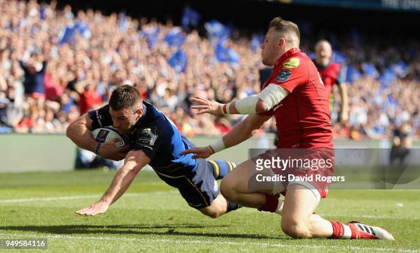 Fergus McFadden of Leinster dives over to score their third try as Steff Evans challenges during the European Rugby Champions Cup Semi-Final match...