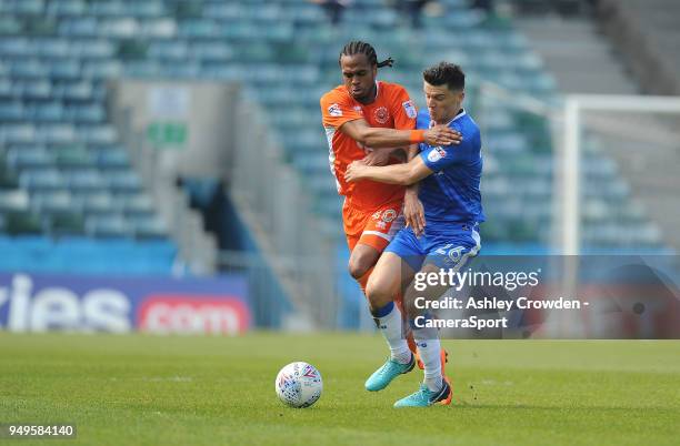 Blackpool's Nathan Delfouneso battles with Gillingham's Callum Reilly during the Sky Bet League One match between Gillingham and Blackpool at...