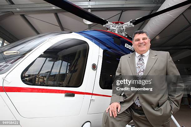 Nick Lappos, senior vice president at Bell Helicopter, poses next to a Bell 429 helicopter on display at the Paris Air Show in Le Bourget, France, on...