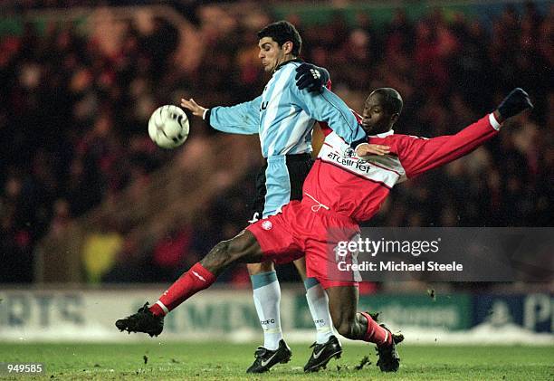 John Aloisi of Coventry City shrugs off the challenge from Ugo Ehiogu of Middlesbrough during the FA Carling Premiership match played at the...