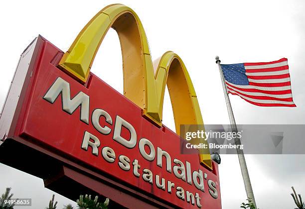 Flag flies outside a McDonald's restaurant in Park Ridge, Illinois, U.S., on Wednesday, May 27, 2009. McDonald's Corp., the world's largest...