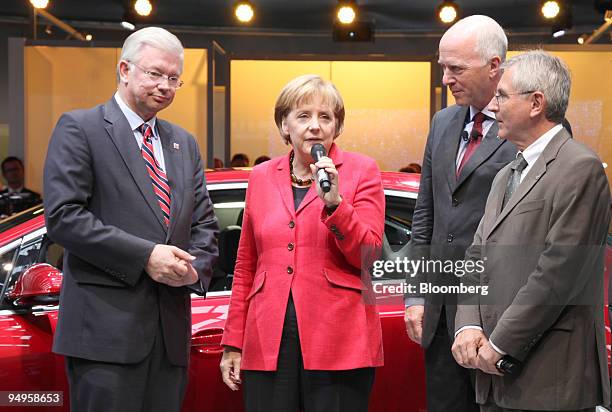 Roland Koch, prime minister of the German state of Hesse, left, Carl-Peter Forster, chairman of General Motors Europe, second from right, and Hans...