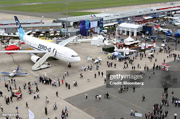 Visitors pass through the Paris Air Show in Le Bourget, France, on Thursday, June 18, 2009. The 48th International Paris Air Show runs from June 15...