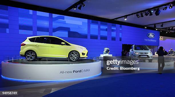 Ford C Max, left, and Ford Grand C Max automobiles sit on display on the second press day of the Frankfurt Motor Show, in Frankfurt, Germany, on...