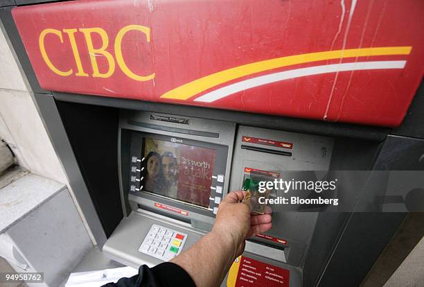 Canadian Imperial Bank of Commerce ATM is used at a branch in Toronto, Ontario, Canada, on Thursday, May 28, 2009. Toronto-Dominion Bank, CIBC, Bank...