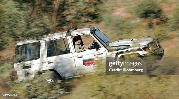 Paul Carter, general manager of exploration, drives a four-wheel-drive vehicle on the site of the Mount Dore molybdenite deposit in Ivanhoe Australia...