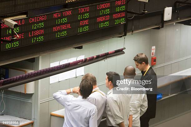 Traders work on an almost empty floor at the Brazilian Bolsa de Mercadorias e Futuros, or Brazilian Mercantile and Futures Exchange , in Sao Paulo,...