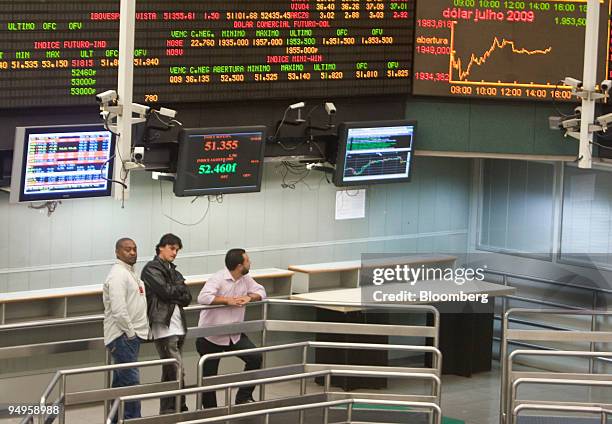 Traders work on an almost empty floor at the Brazilian Bolsa de Mercadorias e Futuros, or Brazilian Mercantile and Futures Exchange , in Sao Paulo,...
