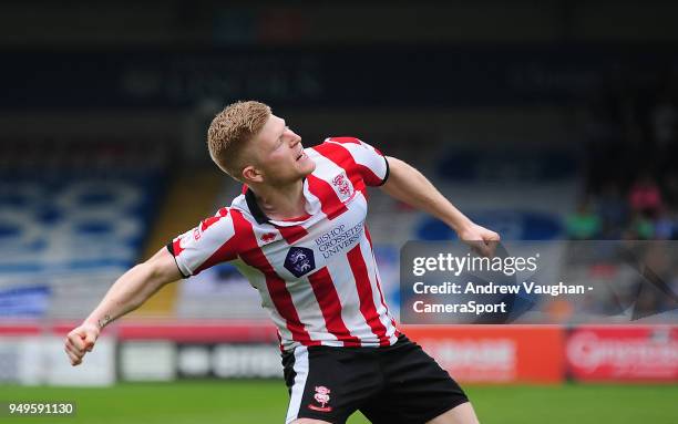 Lincoln City's Elliott Whitehouse celebrates scoring the opening goal during the Sky Bet League Two match between Lincoln City and Colchester United...