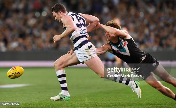 Patrick Dangerfield of the Cats and Jared Polec of Port Adelaide during the round five AFL match between the Port Adelaide Power and the Geelong Cats...
