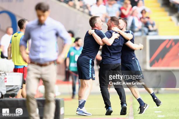 Head coach Pal Dardai of Berlin celebrates with assistant coaches during the Bundesliga match between Eintracht Frankfurt and Hertha BSC at...
