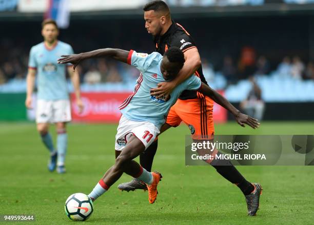 Celta Vigo's Danish forward Pione Sisto vies with Valencia's Portuguese defender Ruben Vezo during the Spanish league football match between Celta de...