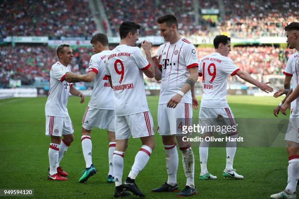 Robert Lewandowski of Munich celebrate after his first goal during the Bundesliga match between Hannover 96 and FC Bayern Muenchen at HDI-Arena on...