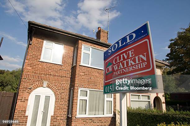 An estate agent's sign advertises a sold property on display outside a house in West Kirby, U.K., on Friday, Sept. 18, 2009. U.K. Home sellers raised...