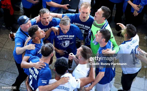 Players of 1. FC Magdeburg celebrate their Second Bundesliga promotion after the 3. Liga match between 1. FC Magdeburg and SC Fortuna Koeln at...