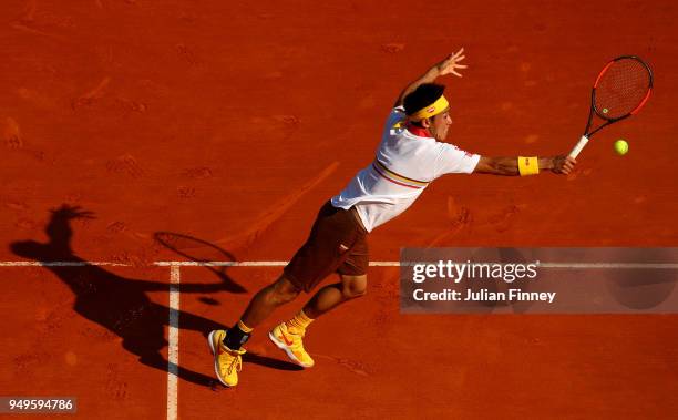 Kei Nishikori of Japan plays a back hand during his men's Semi-Final match against Alexander Zverev Jr. Of Germany during day seven of ATP Masters...