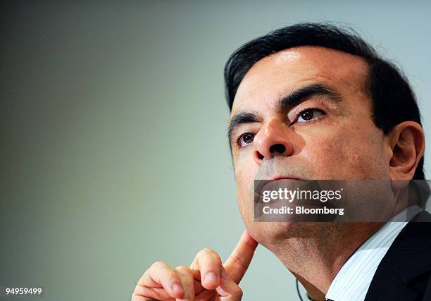 Carlos Ghosn, chief executive officer of Nissan Motor Co., pauses at a news conference after the company's annual general shareholders meeting in...