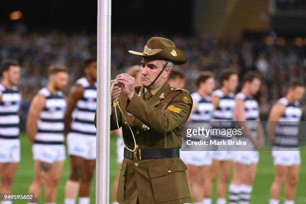 Lowering of the flag during the Anzac Day ceremony during the round five AFL match between the Port Adelaide Power and the Geelong Cats at Adelaide...