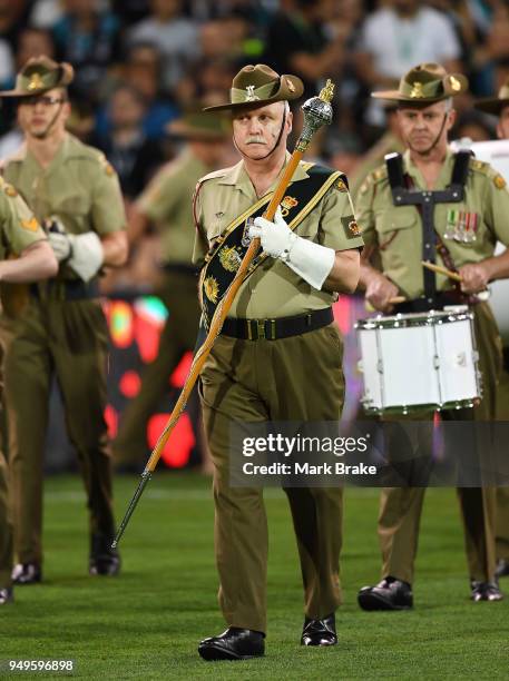 Members of the Australian armed forces march during the Anzac Day ceremony before round five AFL match between the Port Adelaide Power and the...