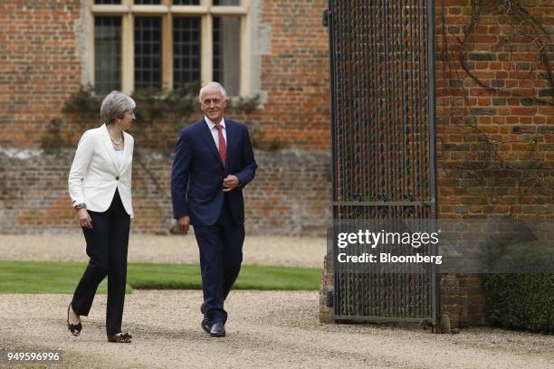 Theresa May, U.K. Prime minister, left, walks with Malcolm Turnbull, Australia's prime minister, during a meeting at Chequers in Aylesbury, U.K., on...