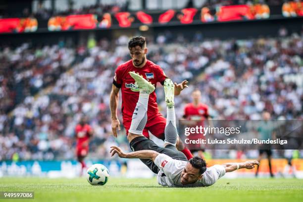 Marco Fabian of Frankfurt is attacked by a player of Berlin during the Bundesliga match between Eintracht Frankfurt and Hertha BSC at...