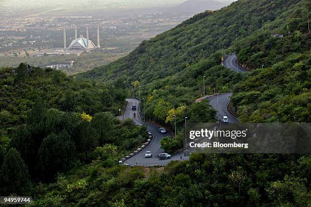 Traffic flows down a highway near the Faisal Mosque, in Islamabad, Pakistan, on Tuesday, June 23, 2009. The U.S. Says Taliban militants threaten the...
