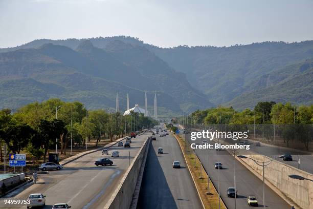 Traffic flows down a highway near the Faisal Mosque, in Islamabad, Pakistan, on Tuesday, June 23, 2009. The U.S. Says Taliban militants threaten the...