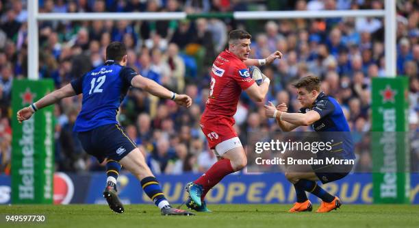 Dublin , Ireland - 21 April 2018; Scott Williams of Scarlets is tackled by Robbie Henshaw, left, and Garry Ringrose of Leinster during the European...