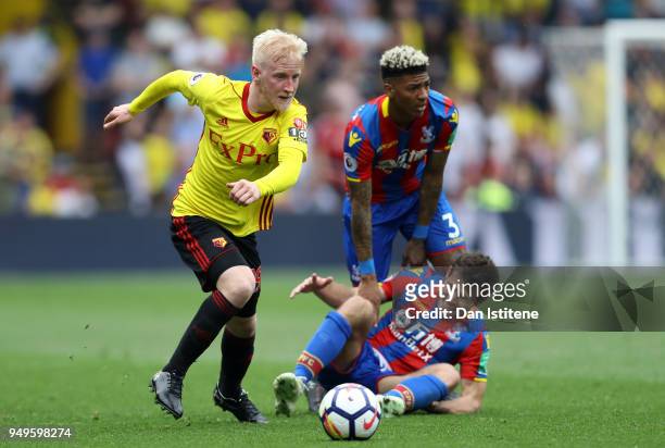 Will Hughes of Watford runs with the ball away from Yohan Cabaye of Crystal Palace and Patrick van Aanholt of Crystal Palace during the Premier...