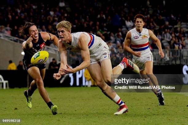 Tim English of the Bulldogs handpasses the ball during the round five AFL match between the Fremantle Dockers and the Western Bulldogs at Optus...