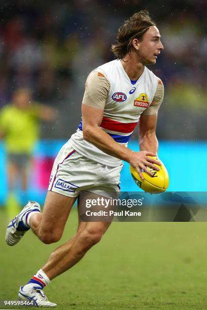 Mitch Honeychurch of the Bulldogs looks to pass the ball during the round five AFL match between the Fremantle Dockers and the Western Bulldogs at...