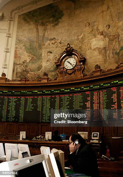 Trader talks on the phone while working on the floor of the Santiago Stock Exchange in Santiago Chile, on Tuesday, June 2, 2009. Declines in the ISPA...