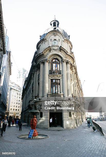 Pedestrians walk past the Santiago Stock Exchange in Santiago Chile, on Tuesday, June 2, 2009. Declines in the ISPA Index of the Santiago Stock...