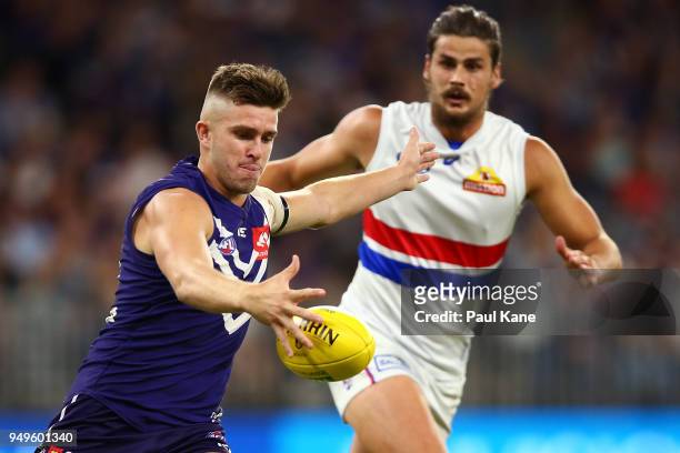 Luke Ryan of the Dockers passes the ball during the round five AFL match between the Fremantle Dockers and the Western Bulldogs at Optus Stadium on...