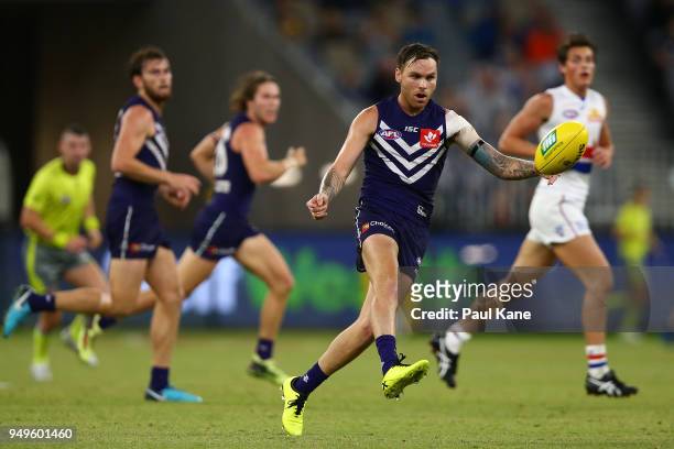 Nathan Wilson of the Dockers passes the ball during the round five AFL match between the Fremantle Dockers and the Western Bulldogs at Optus Stadium...
