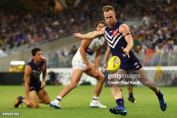 Brandon Matera of the Dockers passes the ball during the round five AFL match between the Fremantle Dockers and the Western Bulldogs at Optus Stadium...