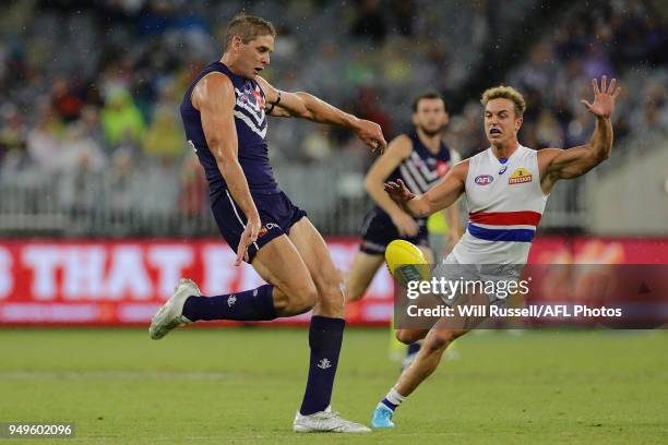 Aaron Sandilands of the Dockers kicks the ball during the round five AFL match between the Fremantle Dockers and the Western Bulldogs at Optus...