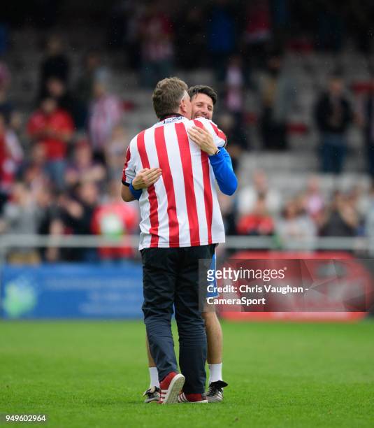 Fan hugs Lincoln City manager Danny Cowley following the Sky Bet League Two match between Lincoln City and Colchester United at Sincil Bank Stadium...