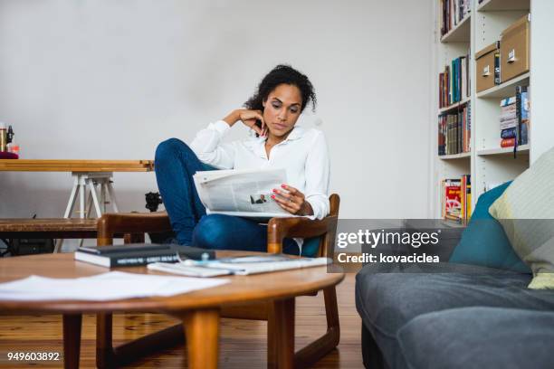 Reading Newspaper Black Woman Photos and Premium High Res Pictures ...