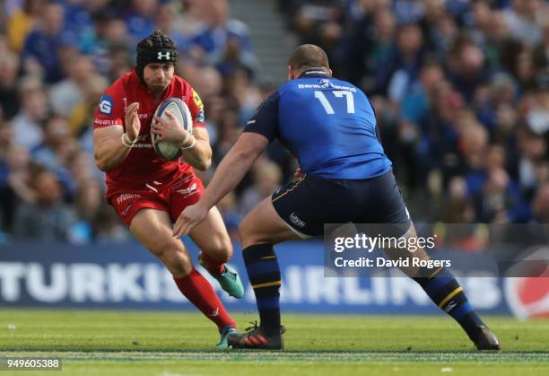 Leigh Halfpenny of the Scarlets takes on Jack McGrath during the European Rugby Champions Cup Semi-Final match between Leinster Rugby and Scarlets at...