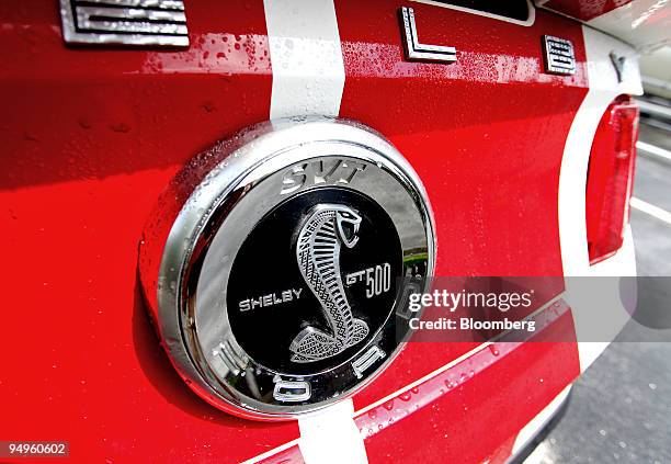 Ford Shelby Cobra GT 500 trunk plate logo is displayed for a photograph during a media test drive in Highland Falls, New York, U.S., on Tuesday, July...