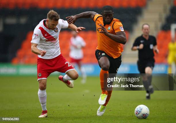 Mickey Demetriou of Newport County AFC and John Akinde of Barnet FC in action during the Sky Bet League Two match between Barnet FC and Newport...