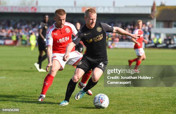 Wigans David Perkins holds off Fleetwood's Paddy Madden during the Sky Bet League One match between Fleetwood Town and Wigan Athletic at Highbury...