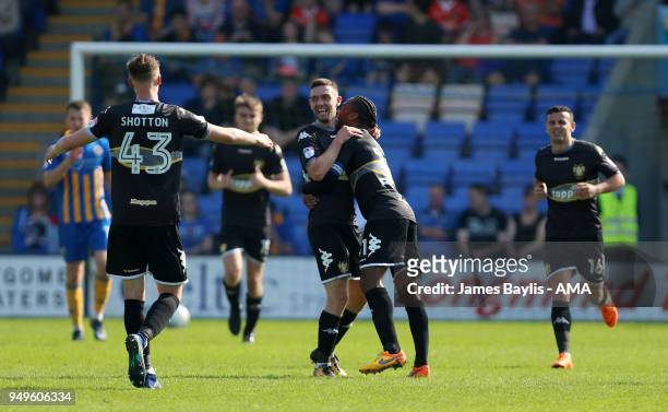 Jay O'Shea of Bury celebrates with his team mates after scoring a goal to make it 1-1 during the Sky Bet League One match between Shrewsbury Town and...