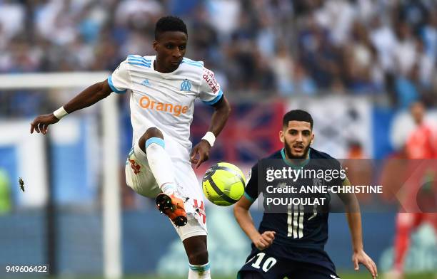 Olympique de Marseille's French forward Bouna Sarr vies with Lille's French forward Yassine Benzia on April 21, 2018 at the Velodrome stadium in...