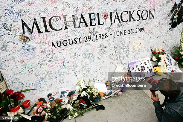 Michael Jackson mural with fan's signatures stands in front of the Staples Center where the public memorial for Jackson is being held in Los Angeles,...