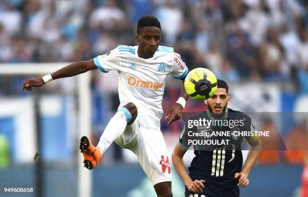 Olympique de Marseille's French forward Bouna Sarr vies with Lille's French forward Yassine Benzia on April 21, 2018 at the Velodrome stadium in...