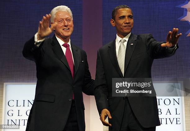 President Barack Obama, right, and Bill Clinton, former U.S. President, arrive at the opening session of the Clinton Global Initiative's annual...