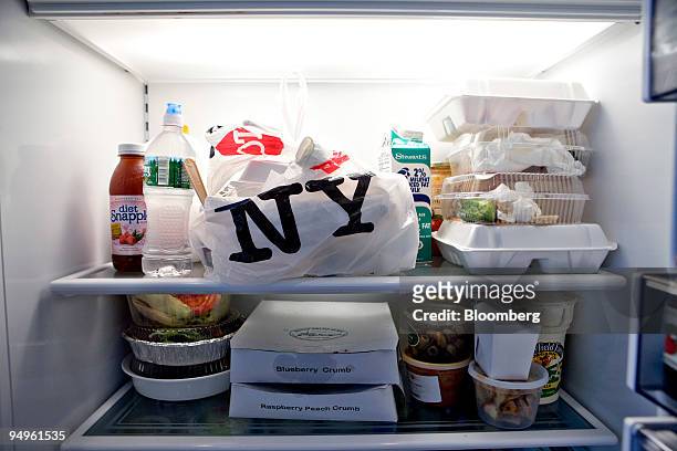 Containers of take-out food fill refrigerator shelves inside the apartment of Marc Dreier, founder of the law firm Dreier LLP sentenced to 20 years...